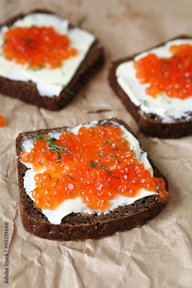 Three slices of bread with butter and caviar Three slices of bread with butter and caviar