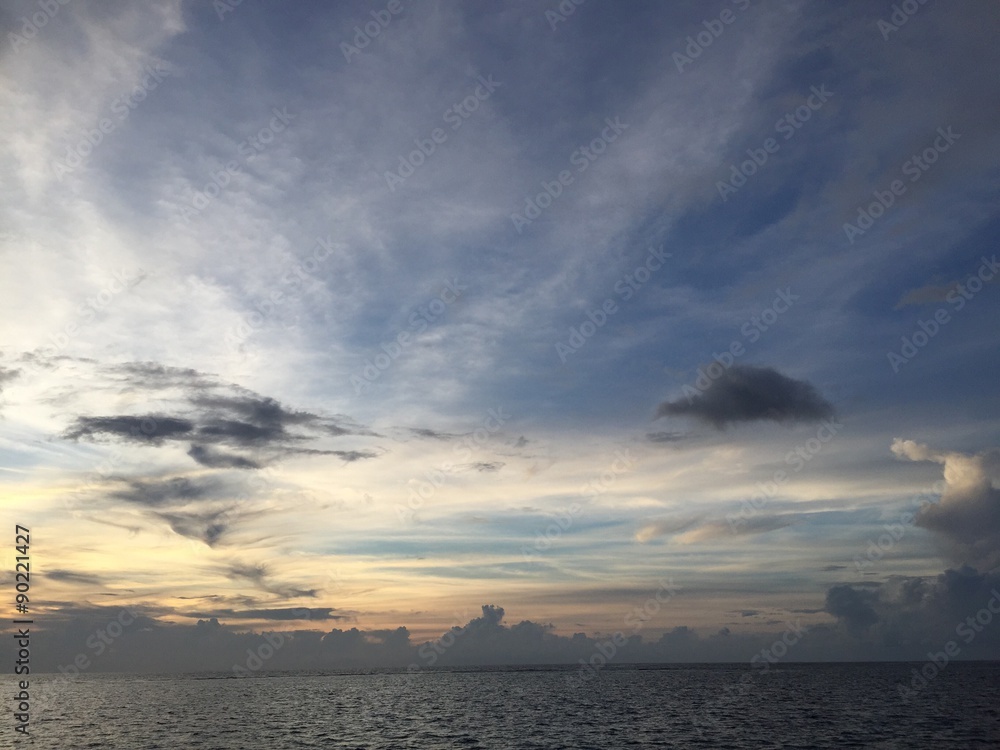 The sky over the tropical ocean during sunset