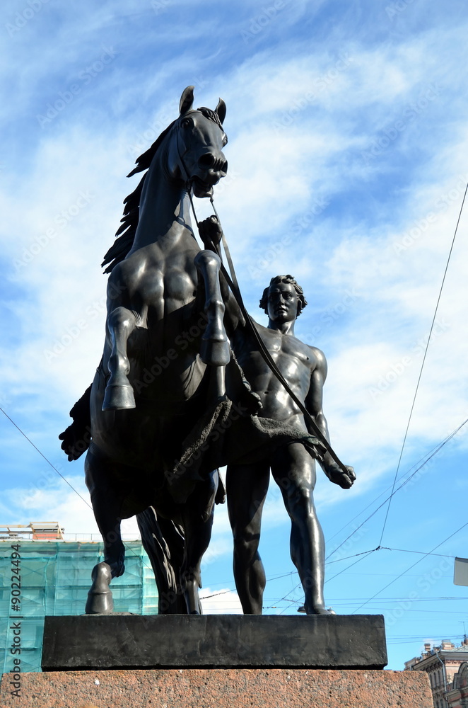 Obraz premium View of Horse tamers monument by Peter Klodt on Anichkov Bridge in Saint-Petersburg Russia. Popular touristic landmark. Built in 1785