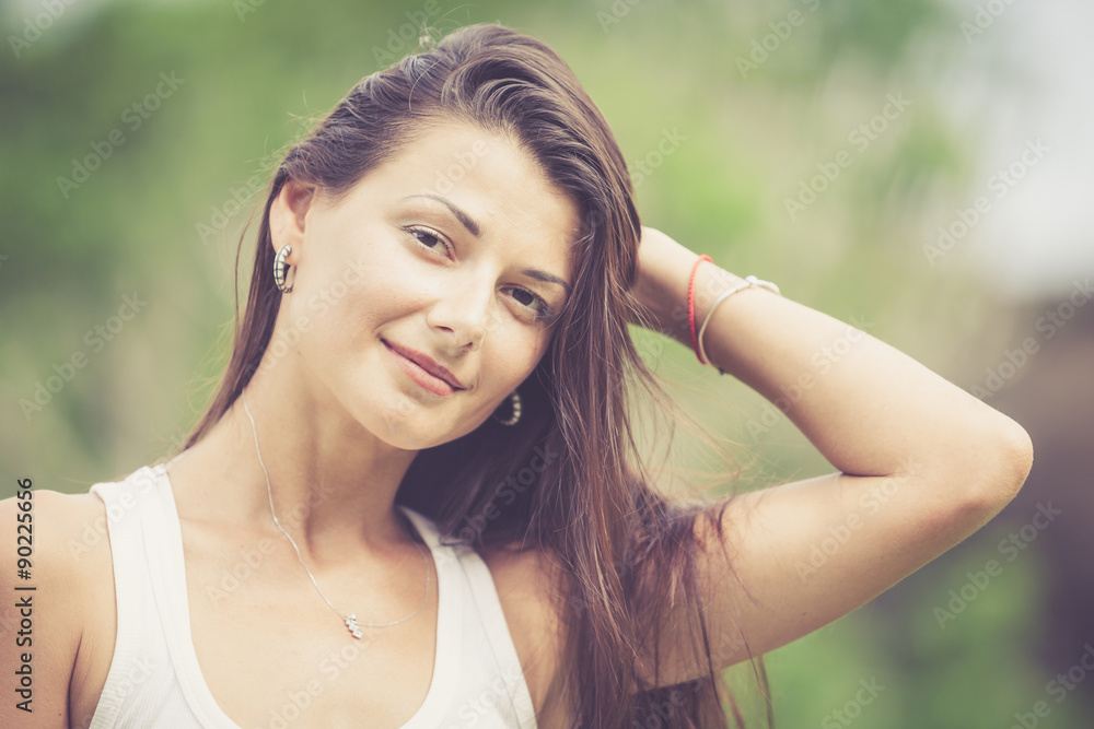 portrait of a beautiful brunette girl outdoor