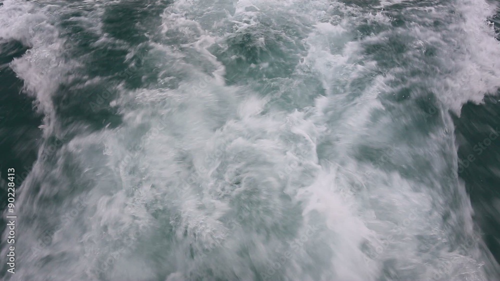 Water waves behind the boat