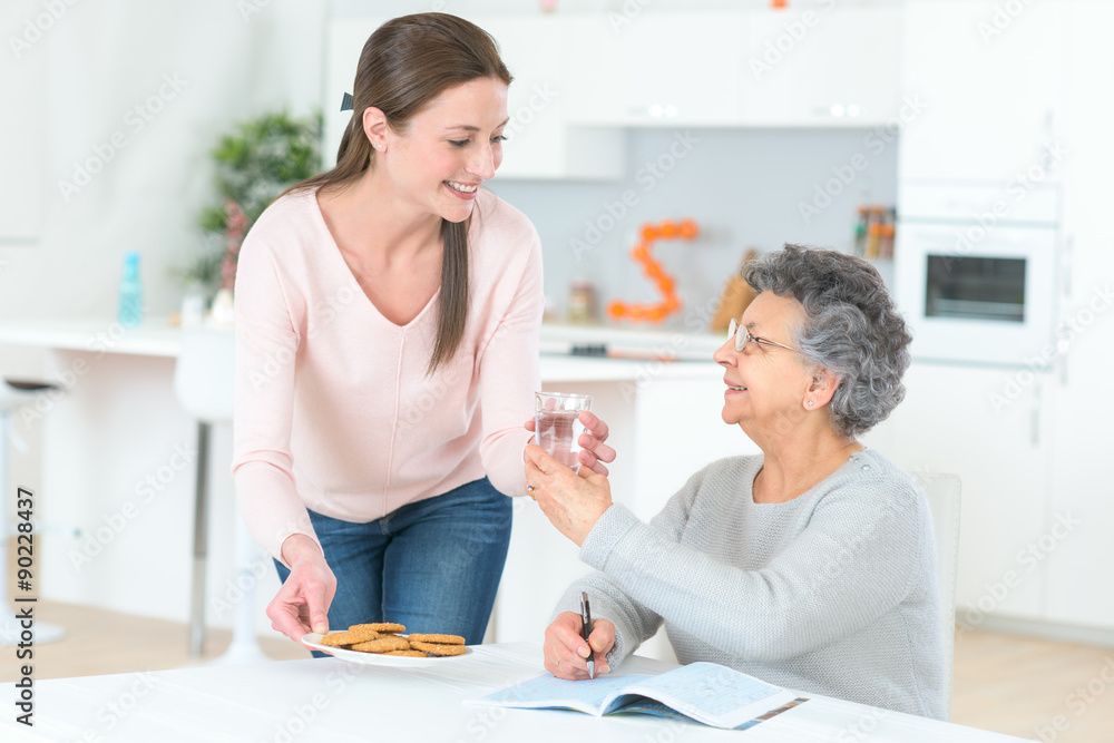 Senior woman taking her daily medication Senior woman taking her daily medication