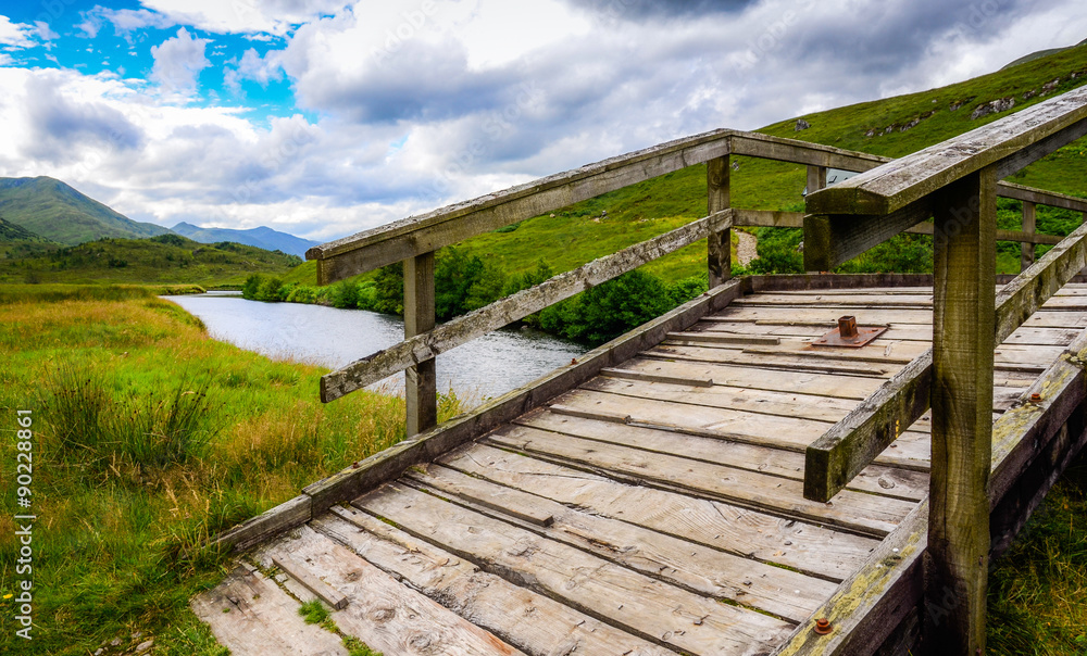 Fototapeta premium Wooden bridge across the river