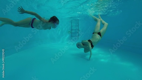 Swimming under the water.