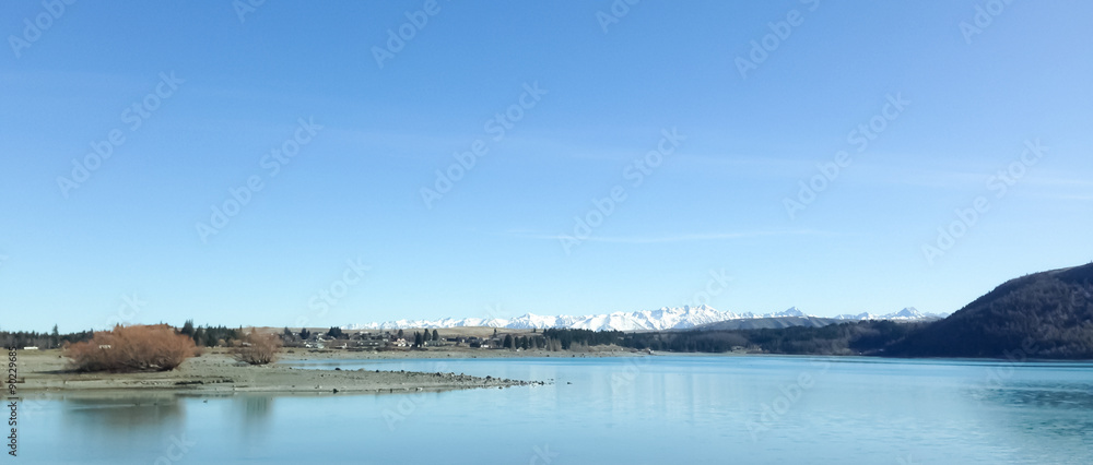 Lake with mountains covered with snow