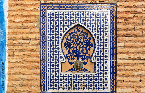 Oriental drinking fountain with beautiful ceramics in Morocco.