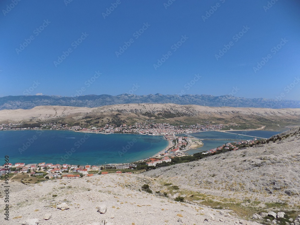 Sea, village, mountains and sky