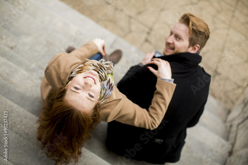 Young red hair couple at au...