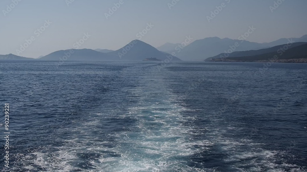 ship's wake with scenic mountains landscape of famous Kotor Bay in Montenegro ship's wake with scenic mountains landscape of famous Kotor Bay in Montenegro