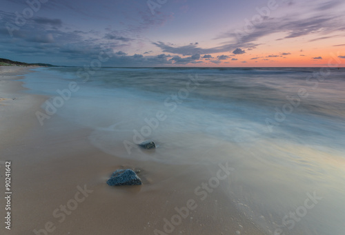 Baltic sea shore at beautiful sunset in Poland, Rowy near Ustka city