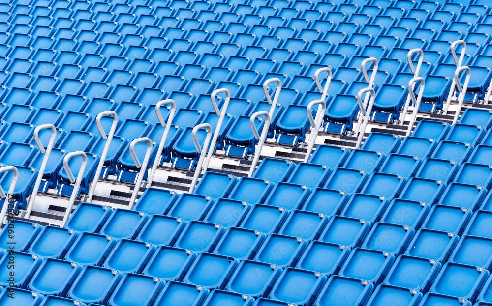 Naklejka premium rows of blue seats in a stadium