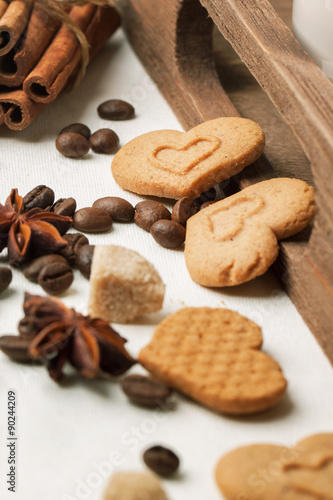 Cookies as hearts with coffee beans and spices