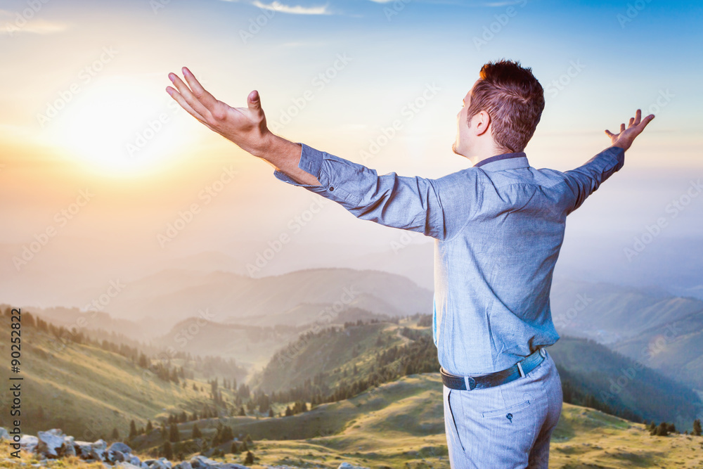 businessman at the top of the mountain sitting and thinking businessman at the top of the mountain sitting and thinking