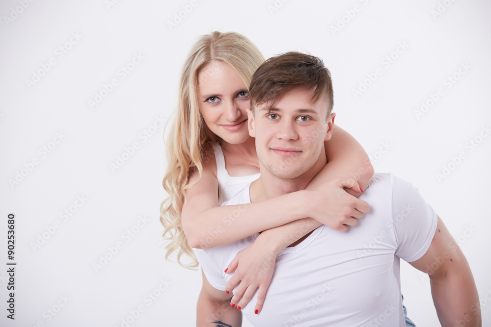 young girl sitting on the man's back young girl sitting on the man's back