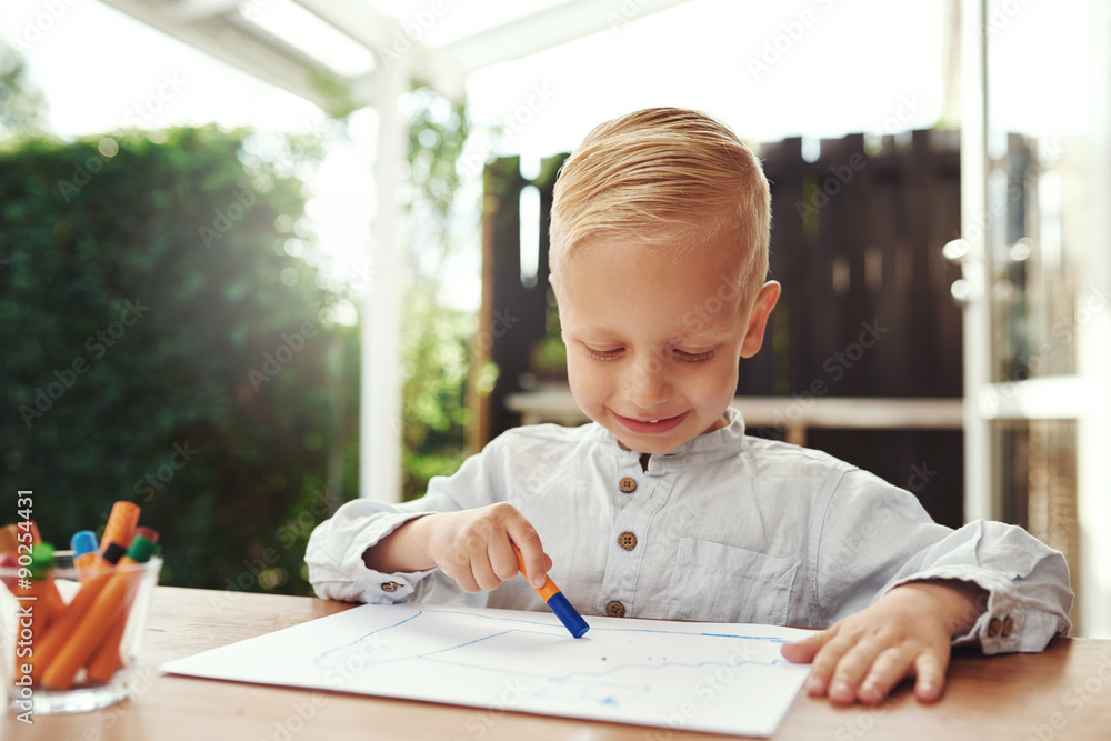 Smiling happy little boy expressing his creativity Smiling happy little boy expressing his creativity
