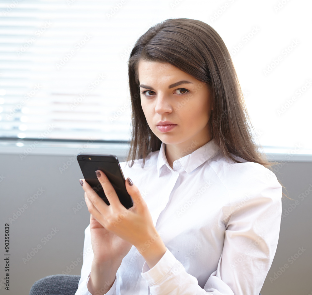 business woman in the office with phone business woman in the office with phone