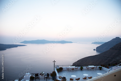A sunset with the sea and Volcanos at Santorini