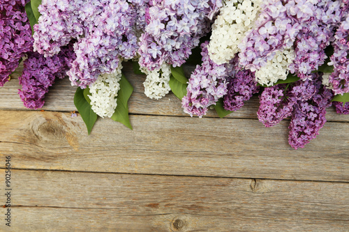 Beautiful lilac on grey wooden background