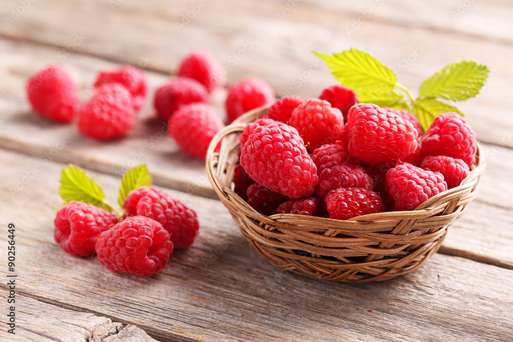 Red raspberries on grey wooden background Red raspberries on grey wooden background