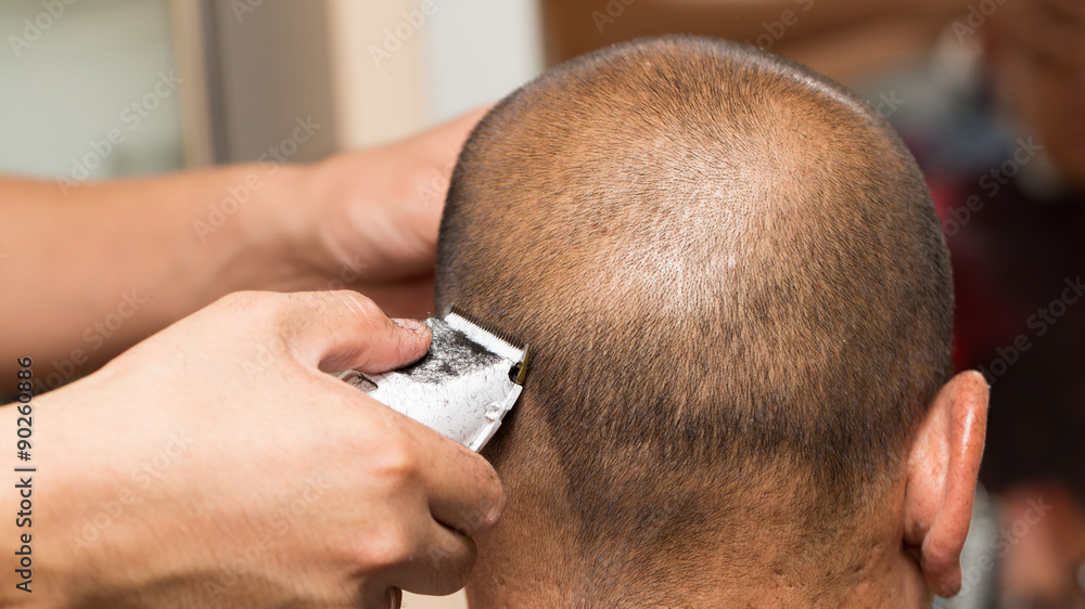 Wunschmotiv: Close up of a male student having a haircut with hair clippers #90260886