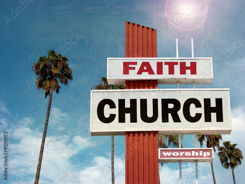 aged and worn vintage photo of church sign with palm trees