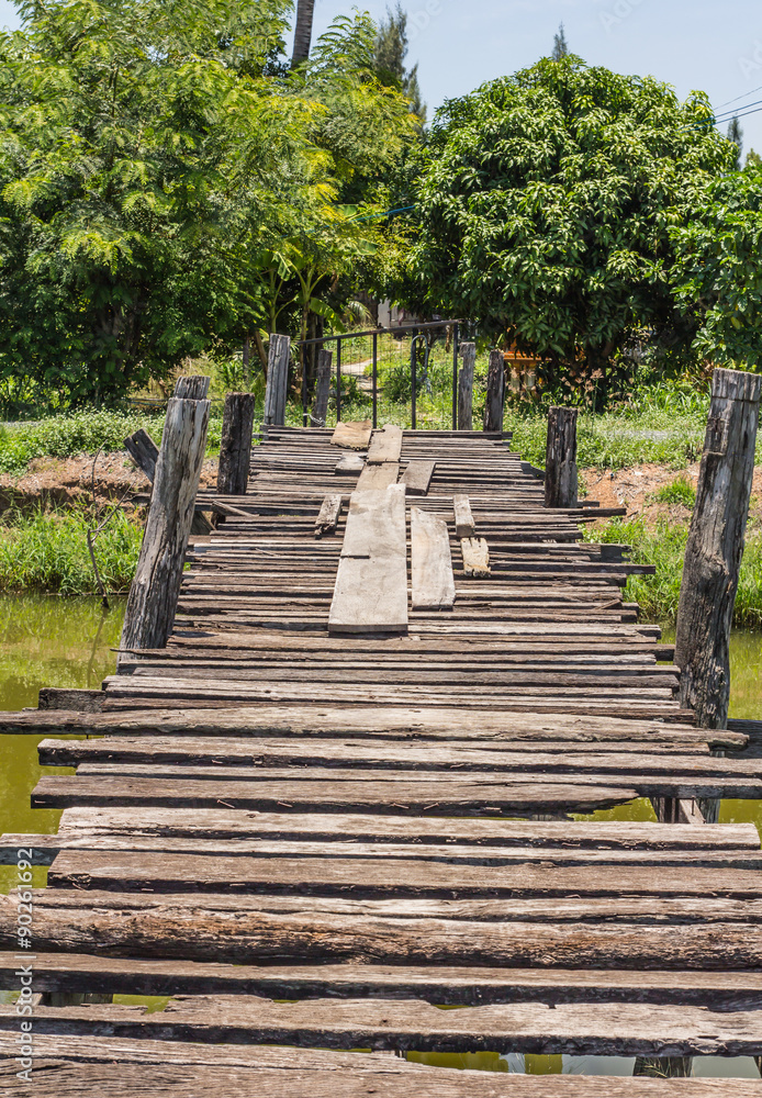 The old wooden bridge on the river