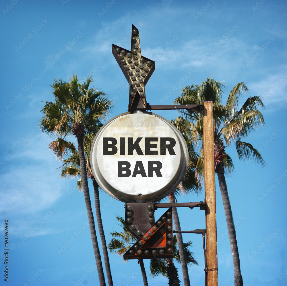 Φωτογραφία aged and worn vintage photo of biker bar sign with palm trees