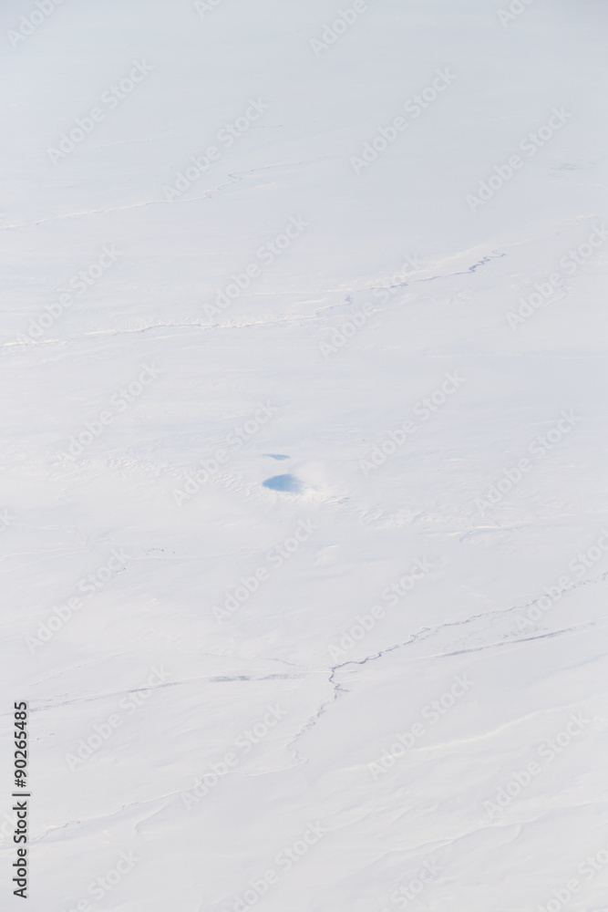 snowy land. view from the airplane as background snowy land. view from the airplane as background