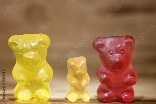 gummy bear family on wooden background