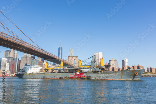 Bulk carrier navigating on East river in New York. © william87