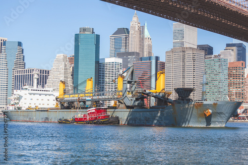 Bulk carrier navigating on East river in New York.