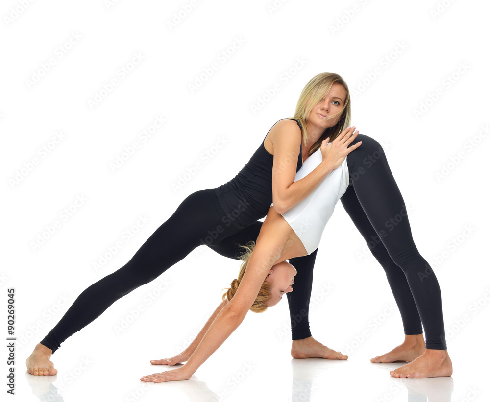Doctor physiotherapist stretching a young sport woman Doctor physiotherapist stretching a young sport woman