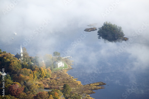 Aerial view of fog in autumn over islands and hills north of Portland Maine © spiritofamerica