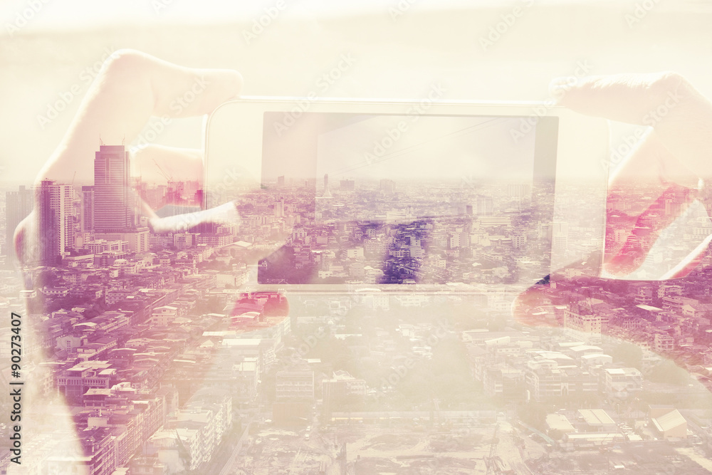 Double exposure of people with smart phone and cityscape background