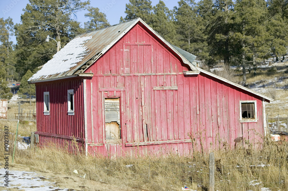 Fototapeta premium Red barn on Mescalero Apache Indian Reservation near Ruidoso and Alto, New Mexico