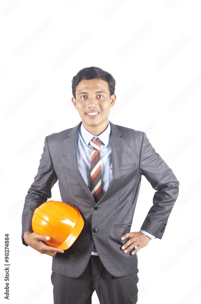 Portrait of asian architect holding helmet isolated on white background Portrait of asian architect holding helmet isolated on white background