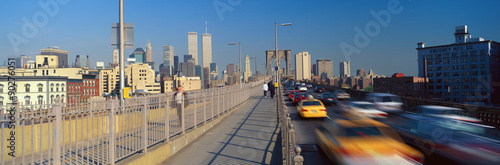 Panoramic view of speeding taxis driving over Brooklyn Bridge to Manhattan, New York City, NY