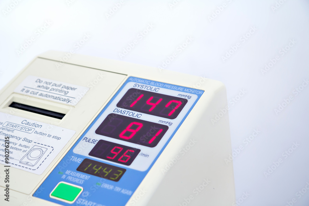 Automatic blood pressure monitor with hypertension isolated on white Automatic blood pressure monitor with hypertension isolated on white