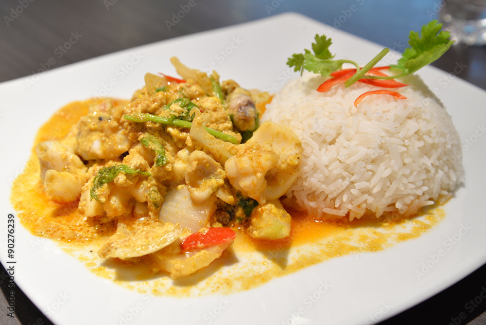 Steamed rice with stir fried curry seafood, Thai-Chinese style, Thailand Steamed rice with stir fried curry seafood, Thai-Chinese style, Thailand