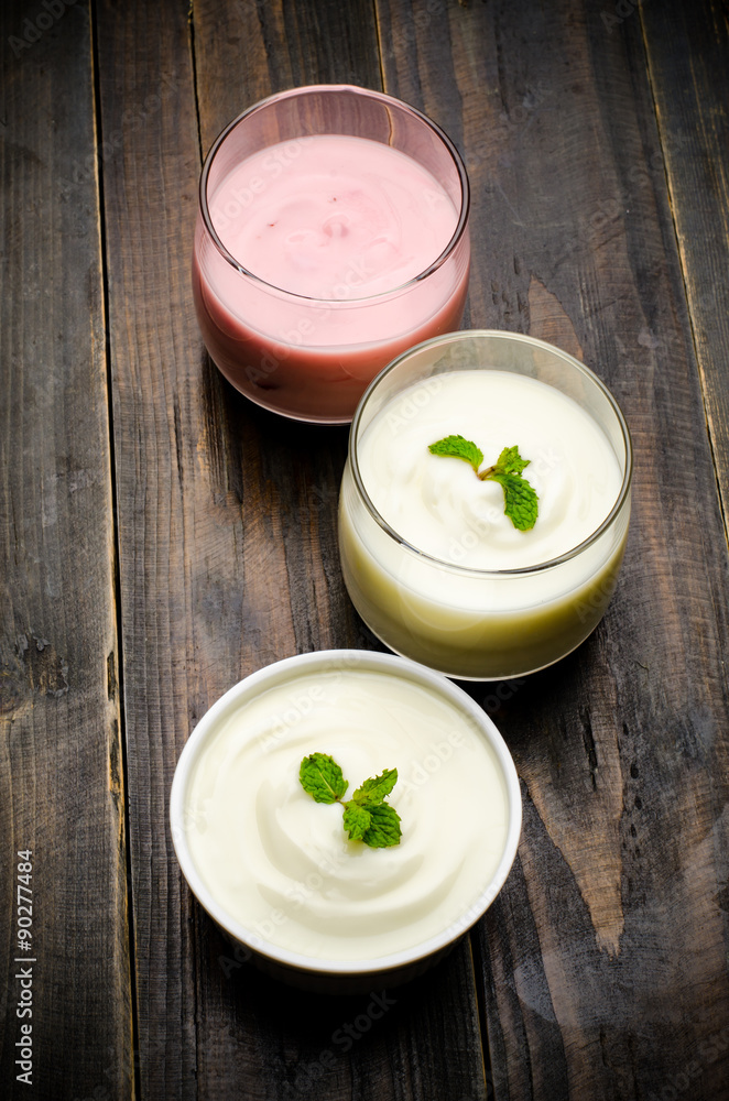 Homemade yogurt on wooden background Homemade yogurt on wooden background