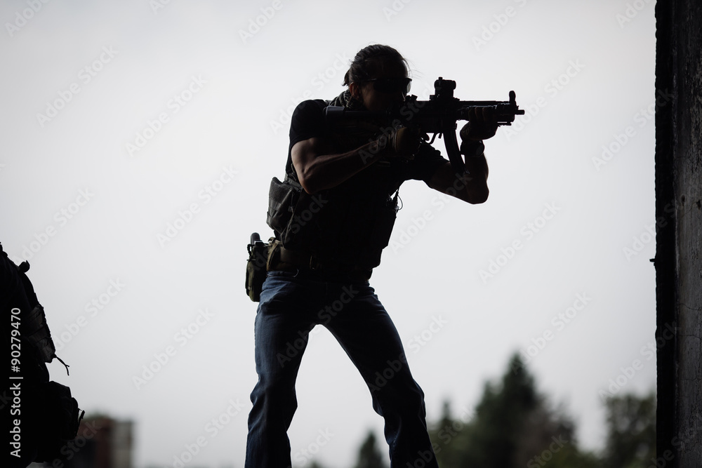Silhouette of terrorist with assault rifle Silhouette of terrorist with assault rifle