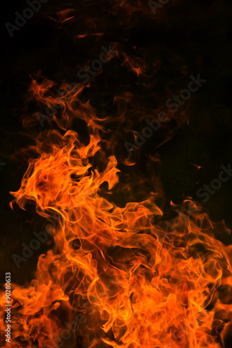 Flames from a fire on dark background