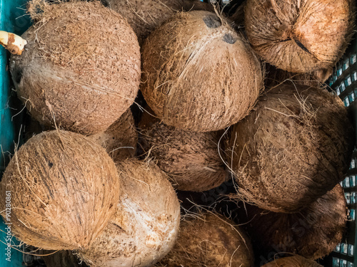 Dry coconuts texture background in blue basket
