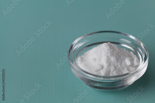 Baking soda, Sodium bicarbonate in glass bowl on wooden table