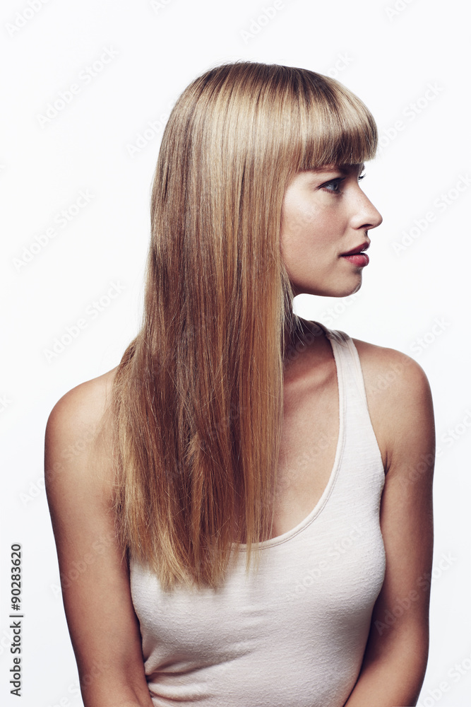 Fototapeta premium Profile of beautiful young woman in studio