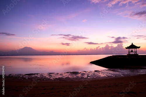 Sunrise over Sanur beach in Bali, Indonesia photo