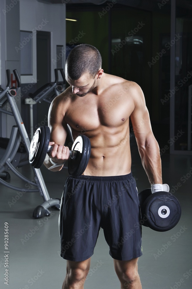 Handsome Muscular Male Model in a Standing Position With Perfect Handsome Muscular Male Model in a Standing Position With Perfect