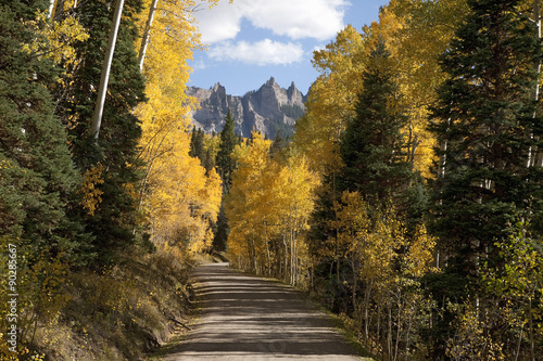 Dirt road leads to Chimney Peak and Courthouse Mountain in the Uncompahgre National Forest, Colorado.