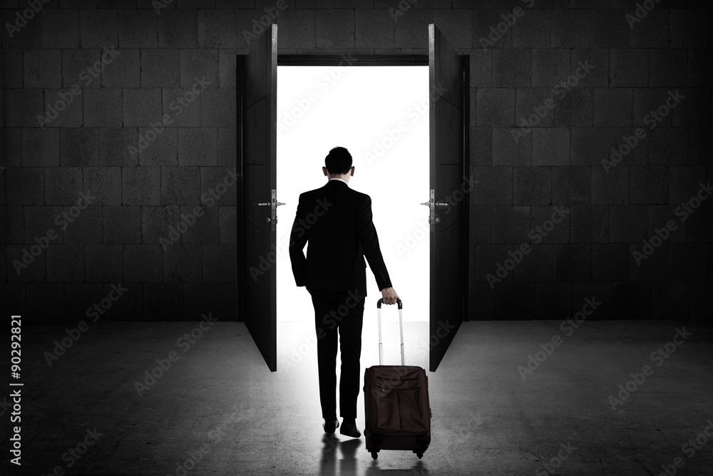 Back view of business man standing toward door Back view of business man standing toward door