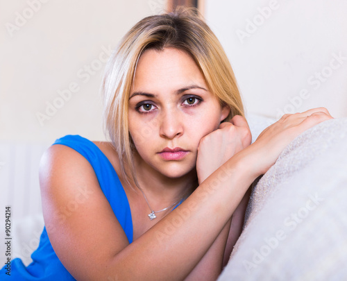 adult girl grieving for something at home